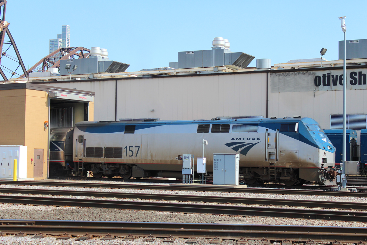 Dirty Amtrak locomotive approaching wash building
