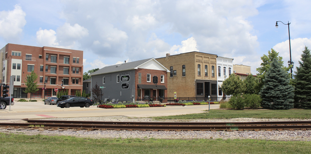 Downtown of small town with railroad track in foreground