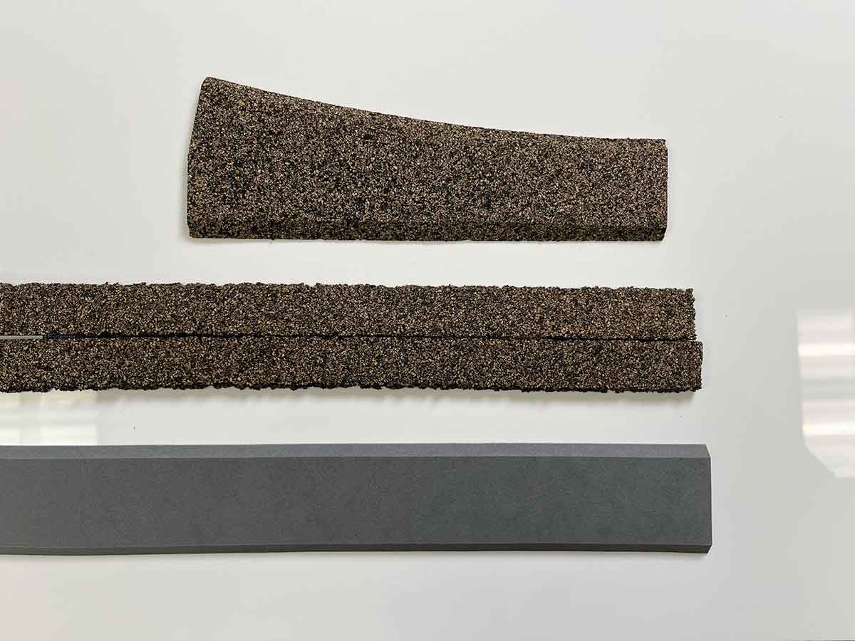 Model rail cork roadbed against a white background