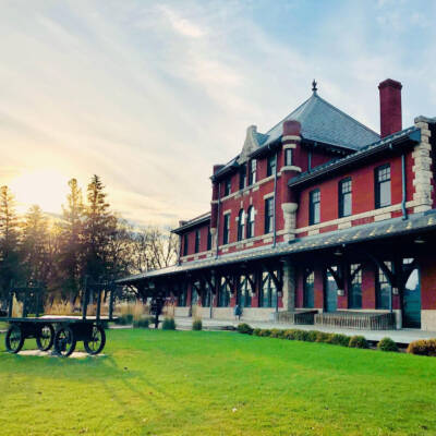 Red brick and stone railroad station.