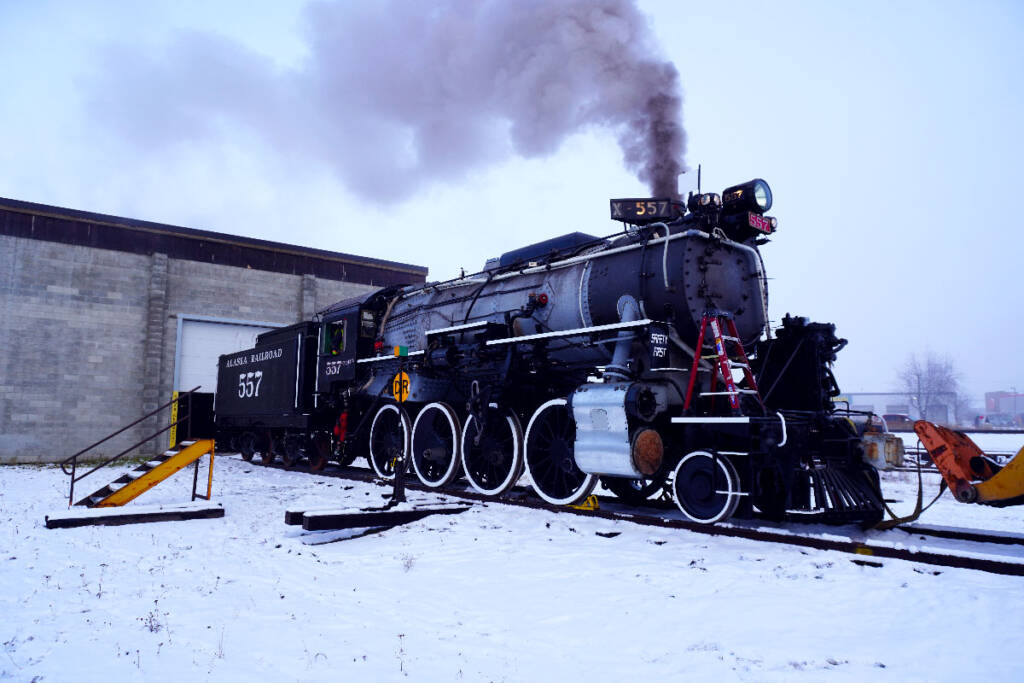 Steam locomotive with smoking stack during test firing.