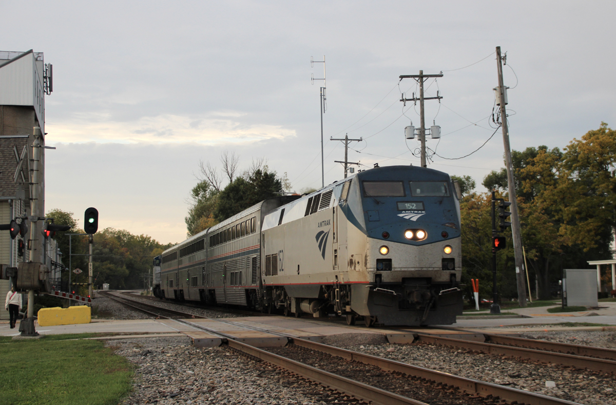 Short passenger train at grade crossing