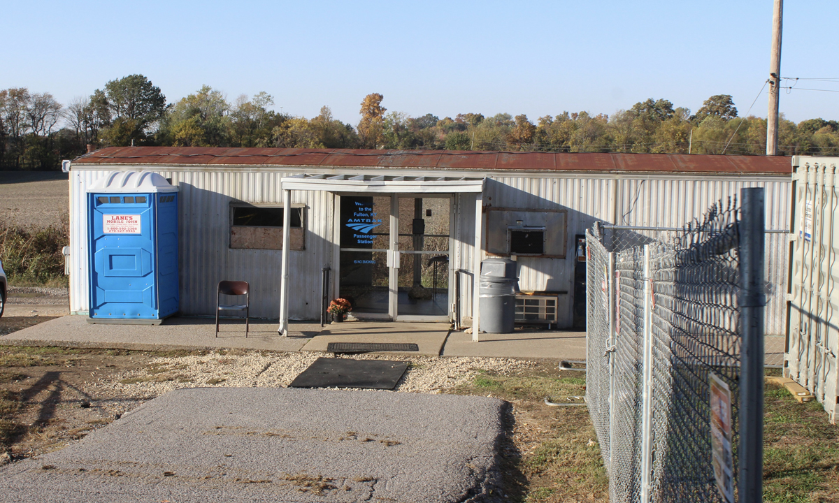White metal-sided building serving as Amtrak station