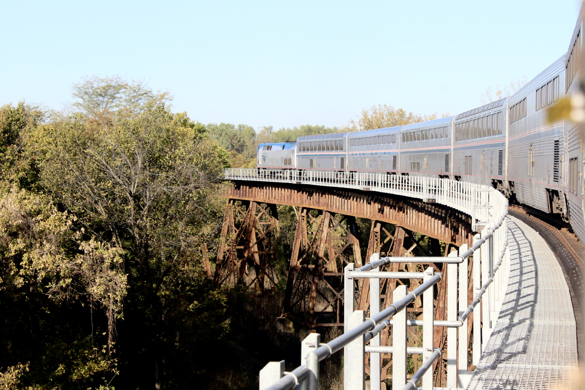 Passenger train on curving bridge