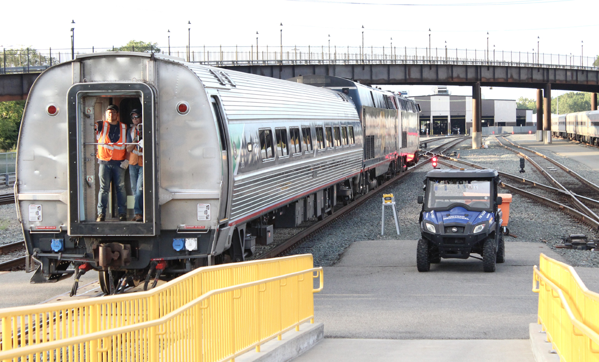 Two locomotives moving one Amfleet passenger car