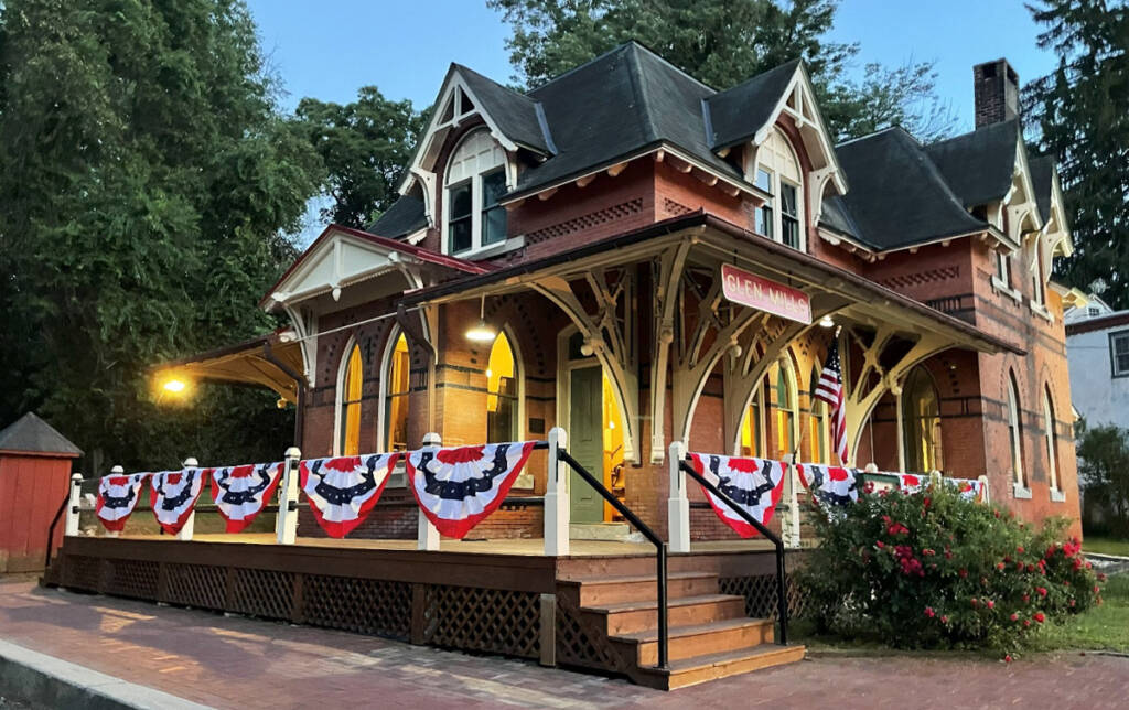 Ornate brick railroad station decorated with bunting