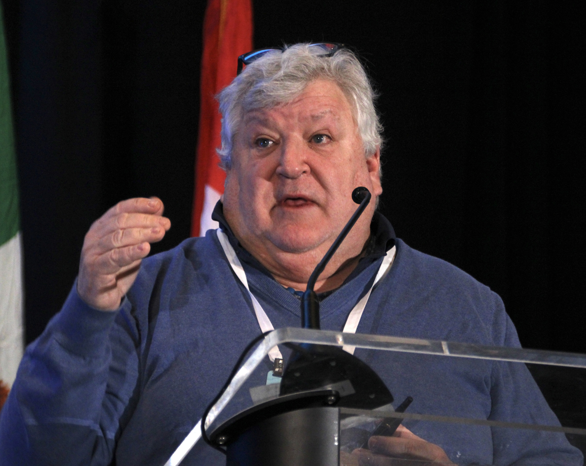 Man gesturing at podium