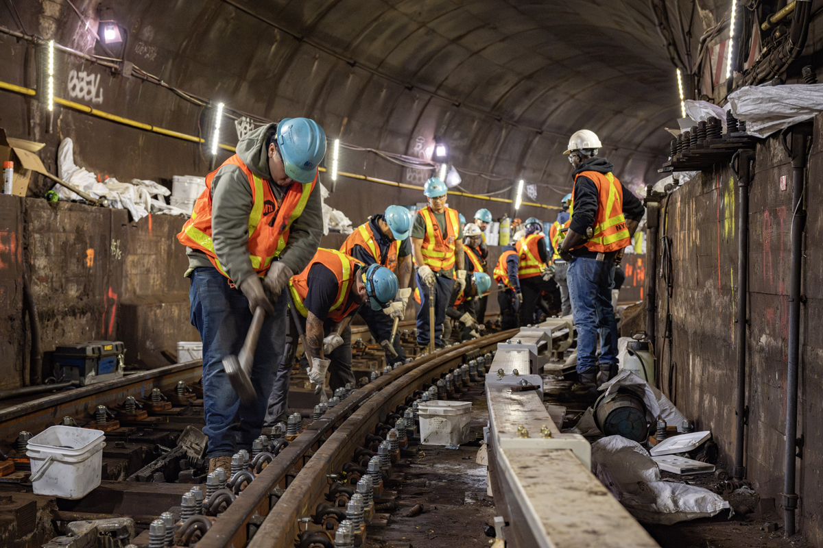 Workers in subway tunnel