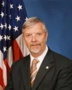 Portrait of man in front of American flag
