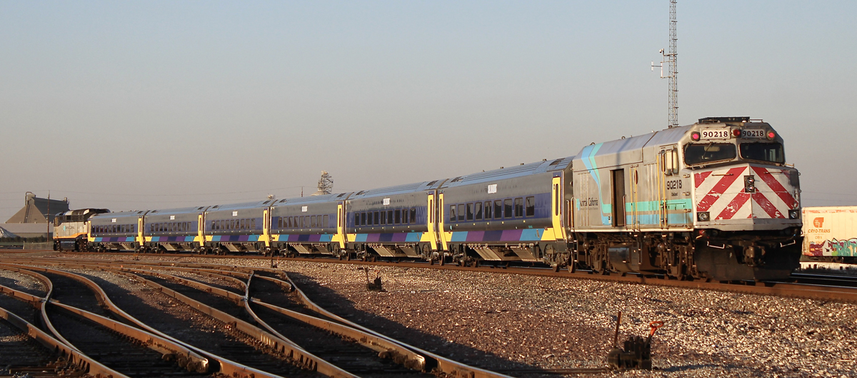 Six-car passenger trian with cab car leading and locomotive trailing