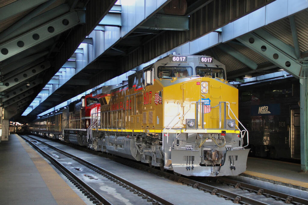 Yellow locomotive on passenger train
