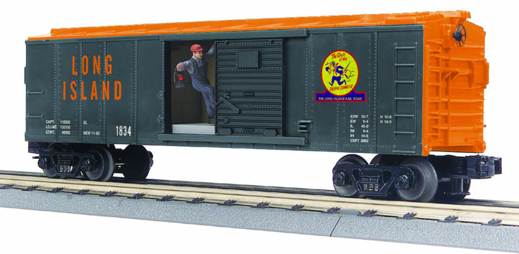black and orange model boxcar with figure