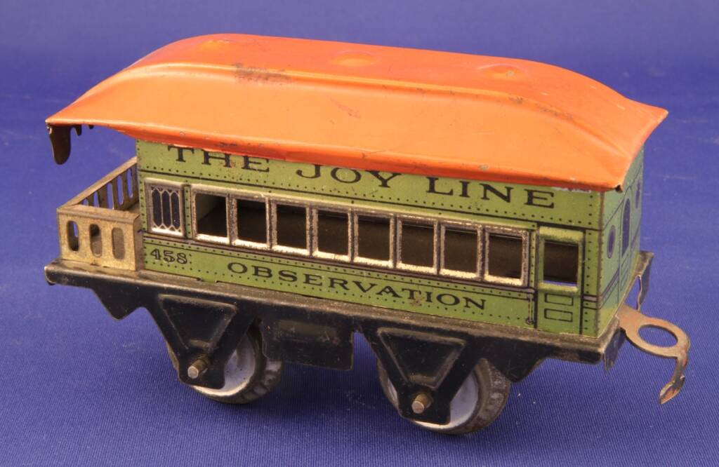 green and red vintage observation car toy