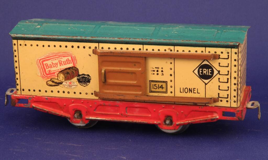 vintage red, cream, and green model toy train car