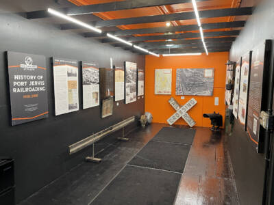 Boxcar interior with a railroad history exhibit.