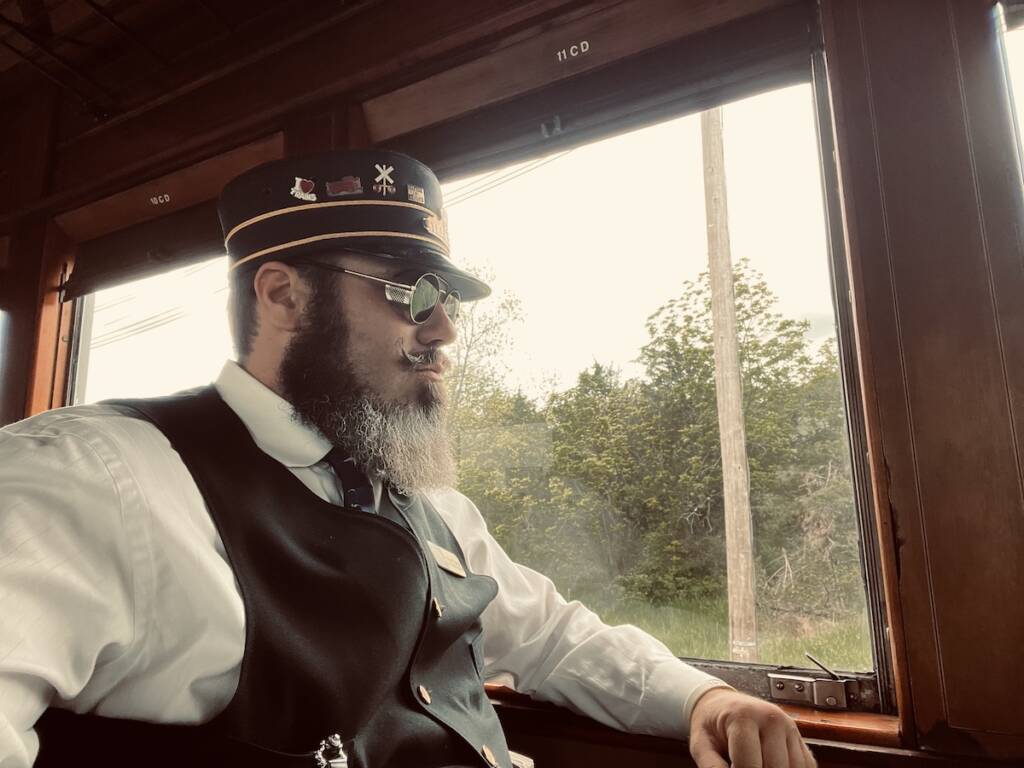 Young individual riding in a passenger car