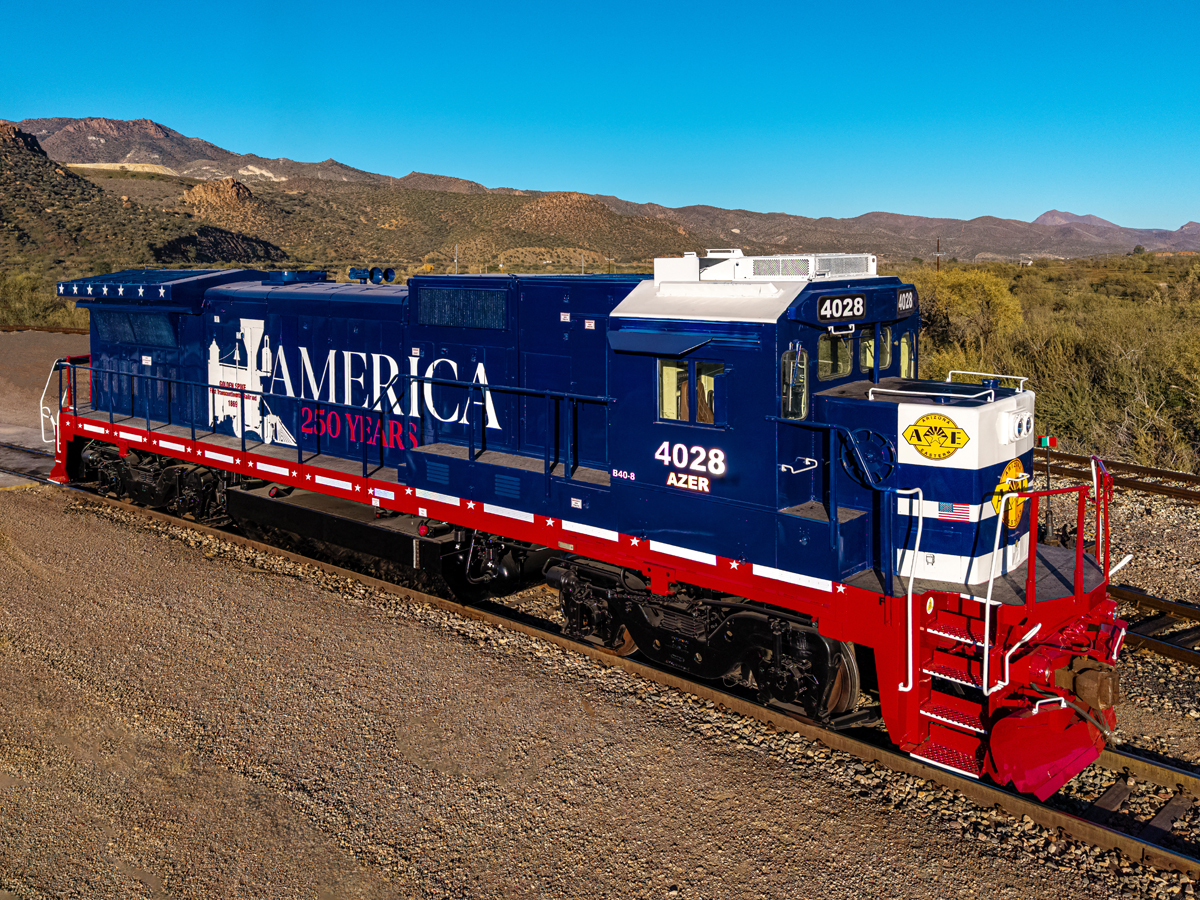 Red, white, and blue locomotive in desert