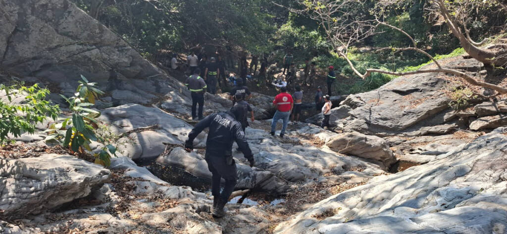 People climbing hillside