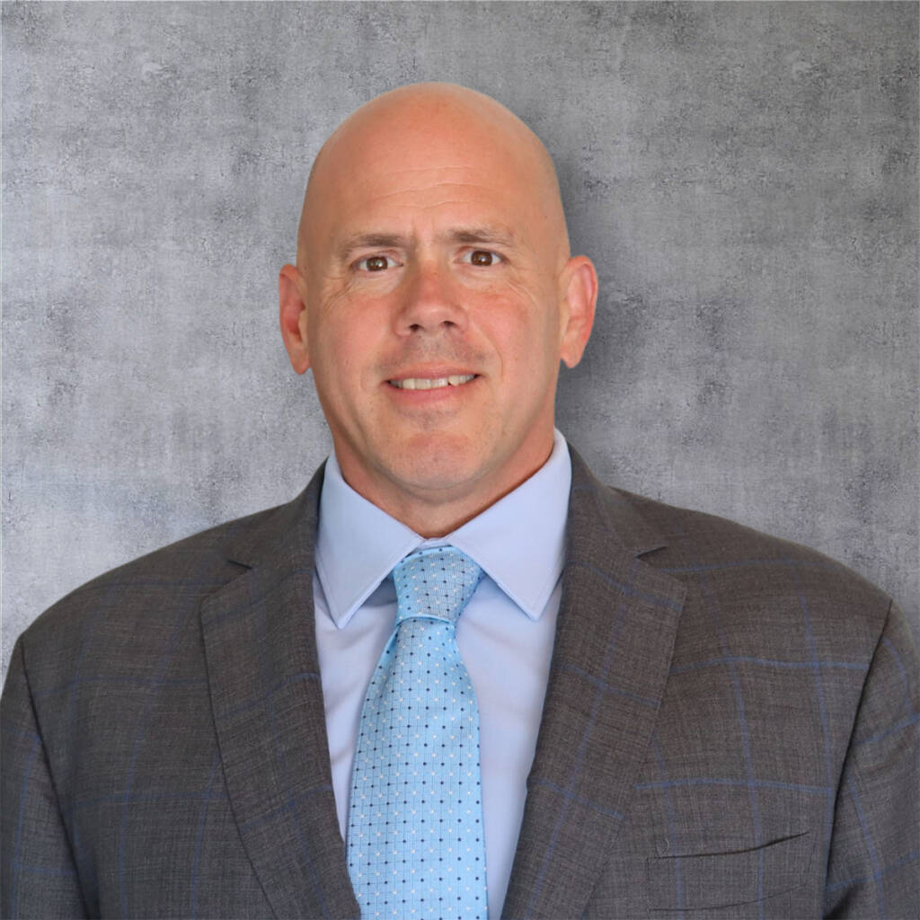 Head shot of man in suit and tie