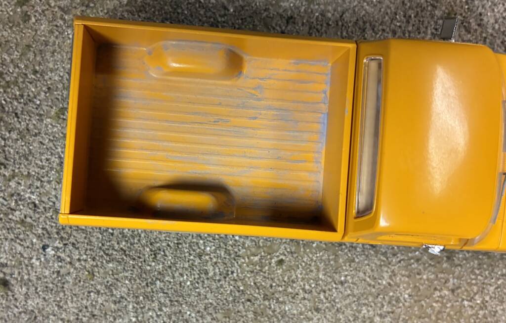 weathered inside of model truck bed