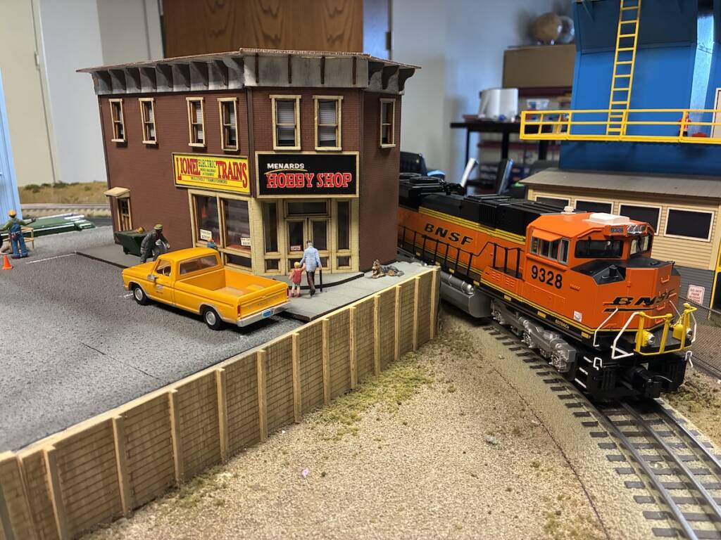 hobby shop with truck and model train on layout scene
