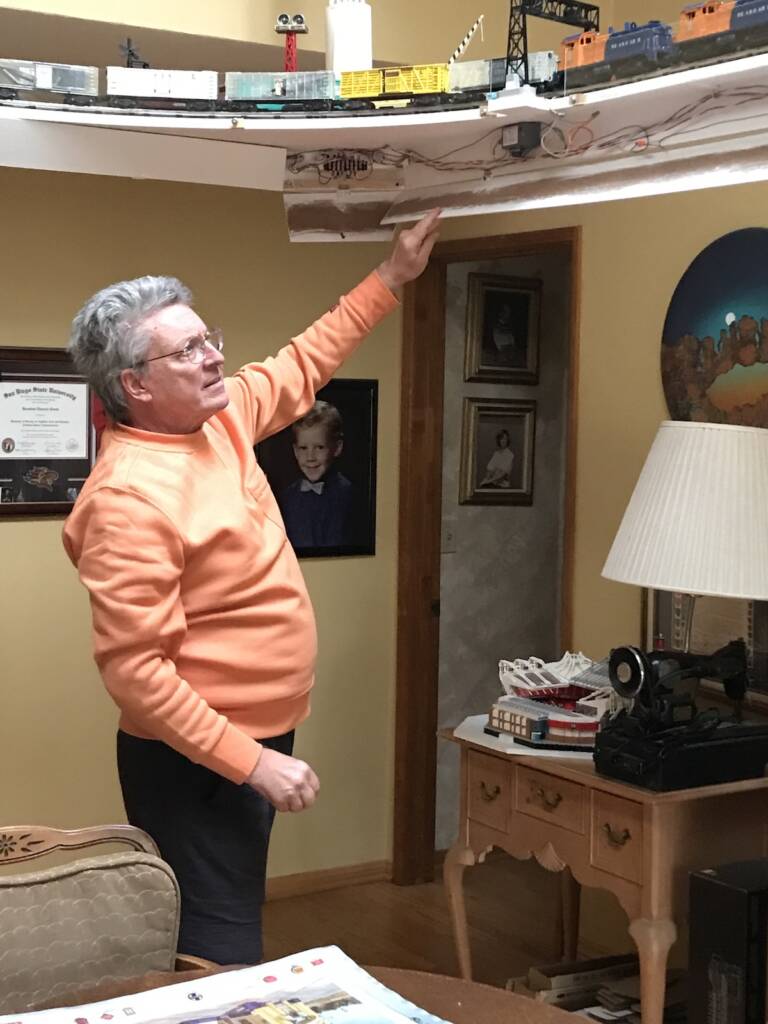 man next to section of elevated layout