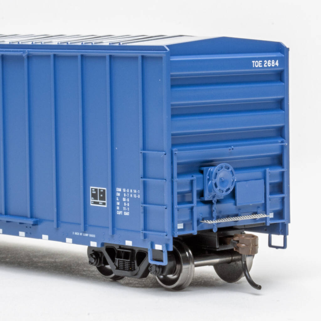 Color photo showing B end of HO scale double-door boxcar with exterior posts painted dark blue with black and white graphics on white background.
