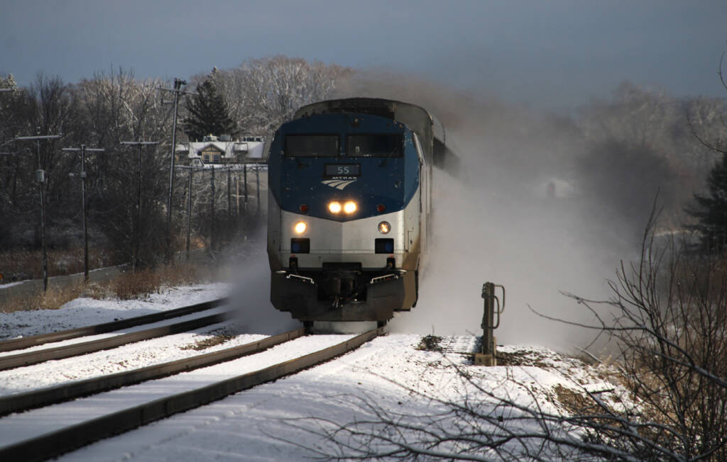 Train kicking up snow