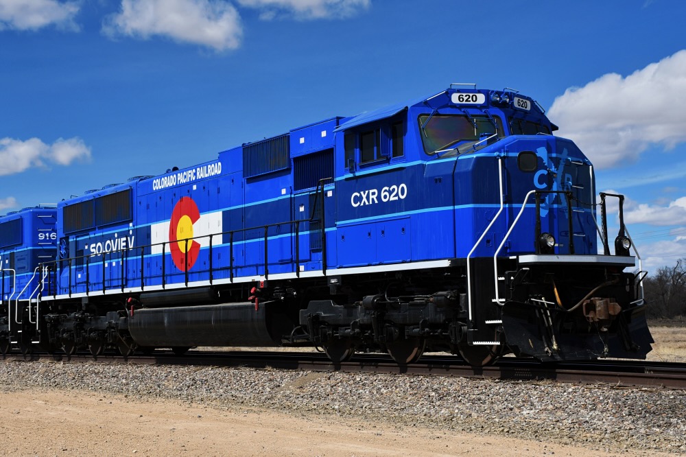 Blue locomotive with Colorado state flag logo