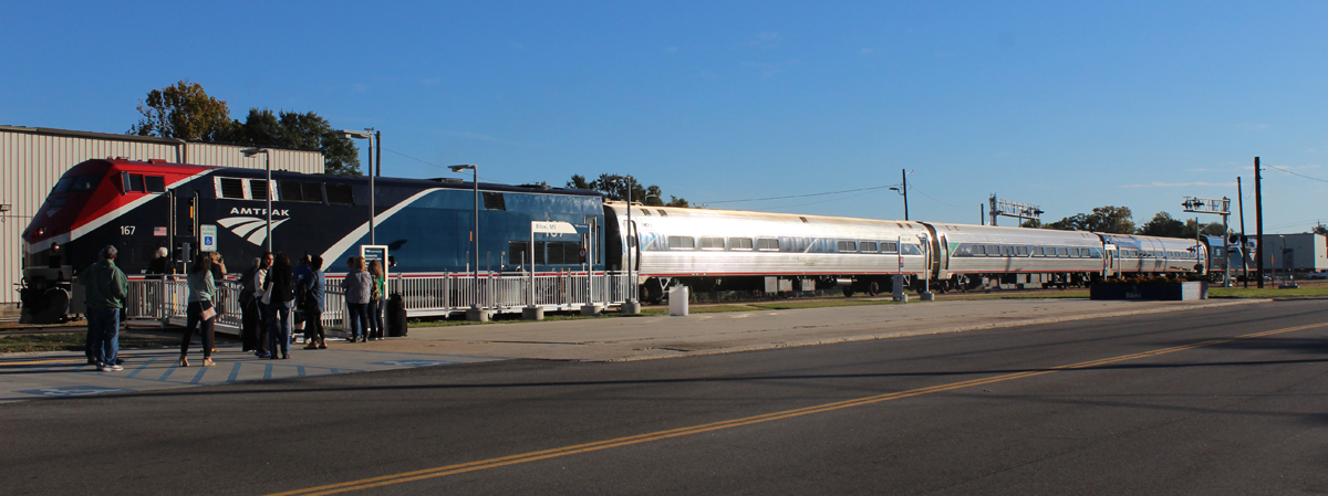 Short passenger train at station platform
