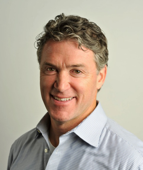 Head shot of man in open-collar shirt