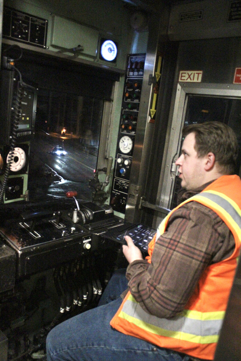 Man in cab of EMU commuter train car