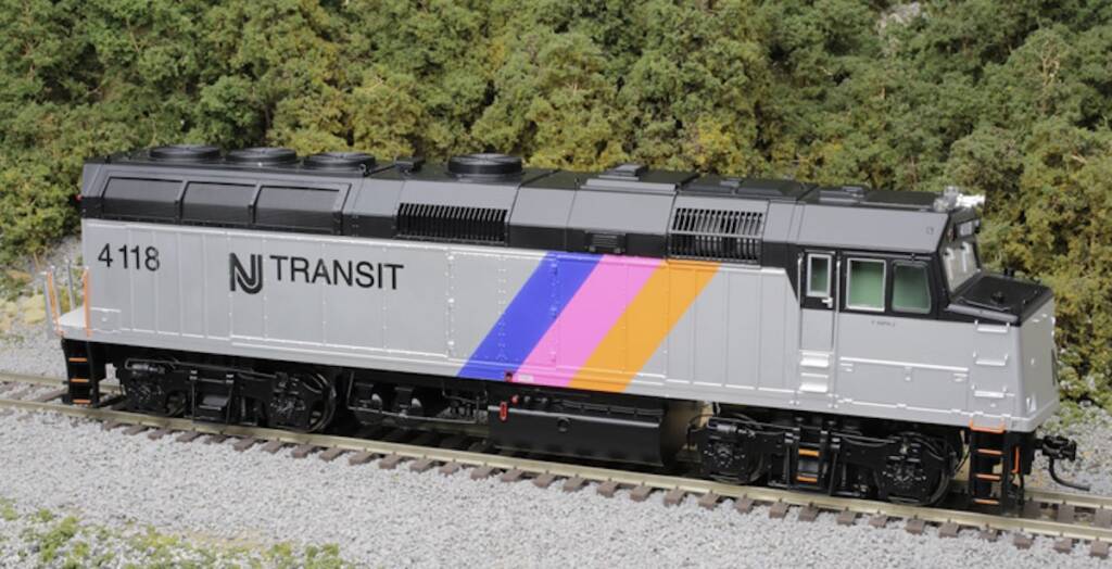 silver locomotive with colored stripes on the side