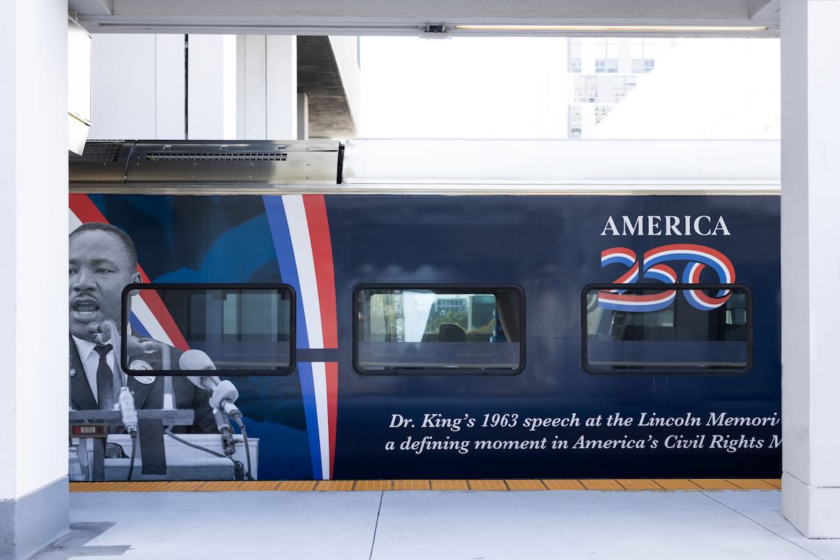 Wrapped red, white, and blue passenger car.