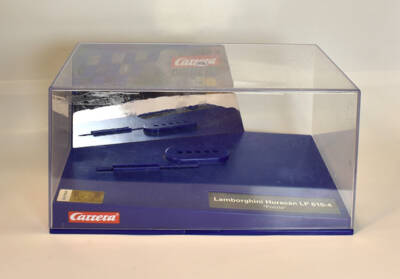 rectangular clear plastic box with a blue base partially visible through the box