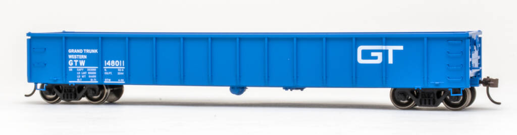 Color photo of HO scale gondola painted blue with white and black graphics on white background. 
