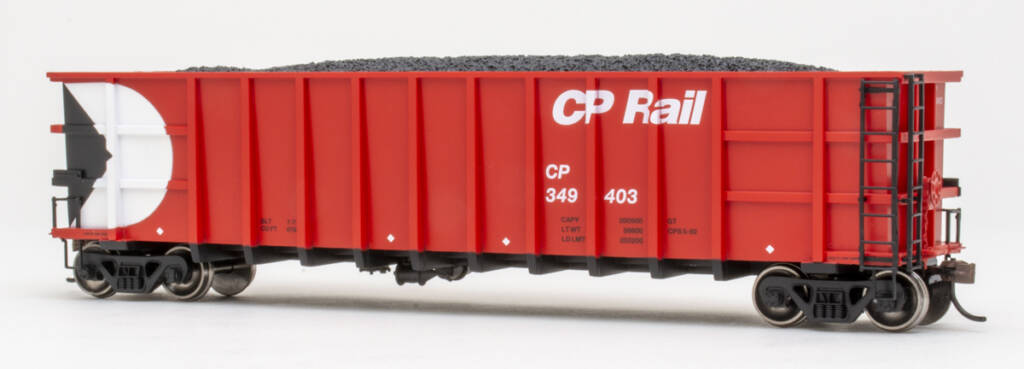 Color photo of HO scale high-side gondola with exterior posts painted red with white and black graphics on white background. 