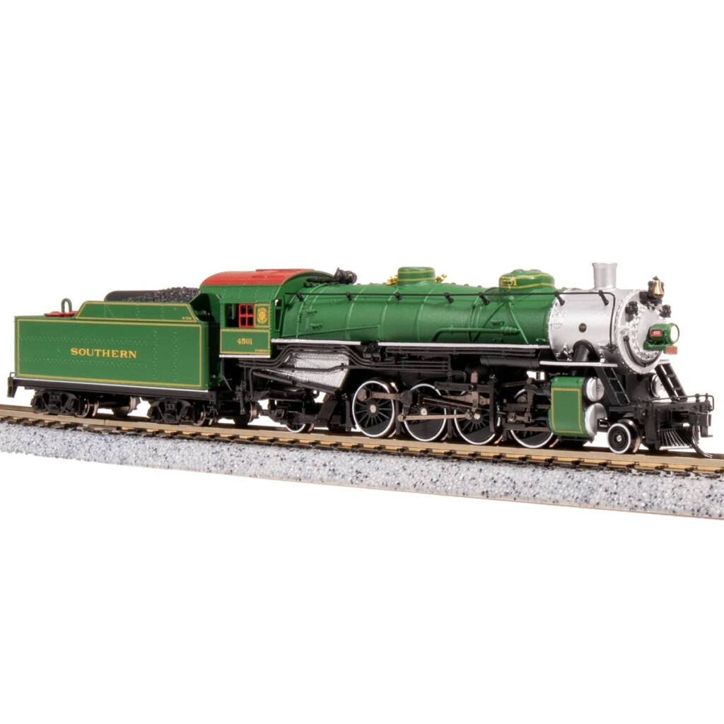 A green model steam locomotive and tender