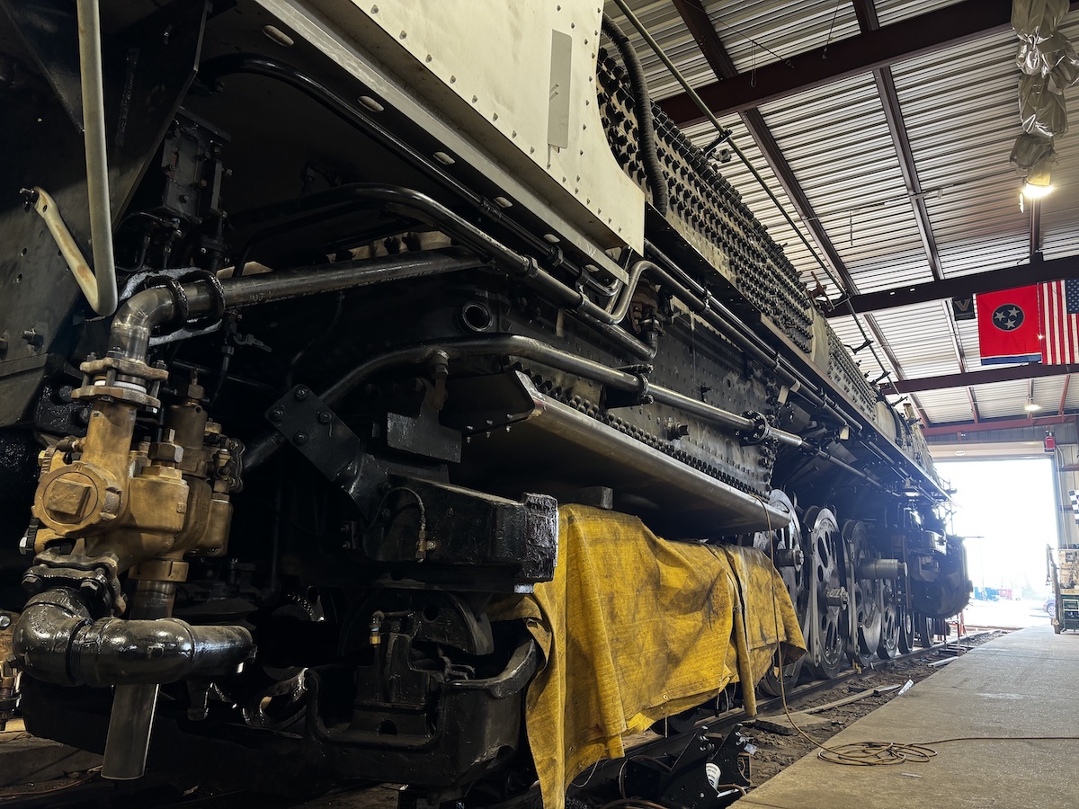 Nearly restored steam locomotive sits inside shop