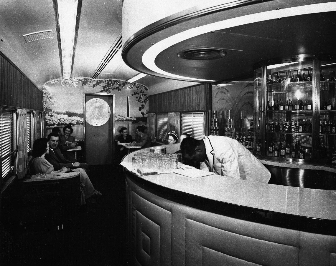 Interior of a lounge car with a semi-circular bar. B&O museum introduces restored 'Washington'.
