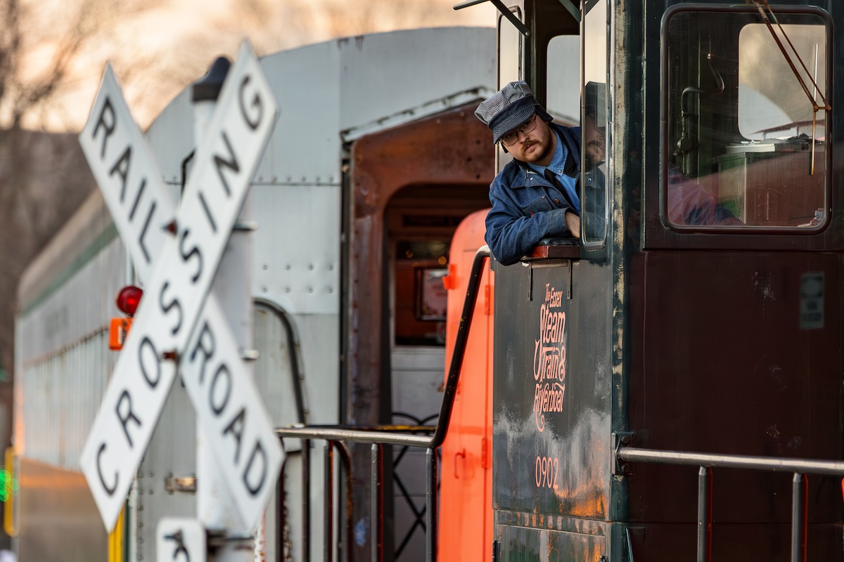 Young individual operating a diesel locomotive