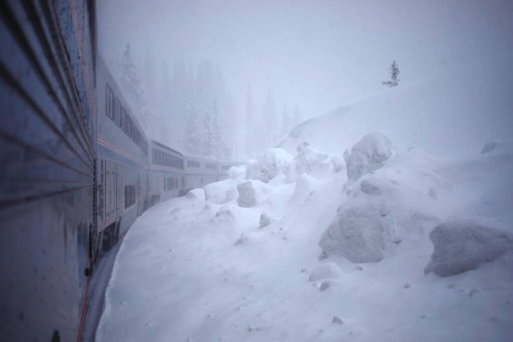 View from onboard passenger train in snow