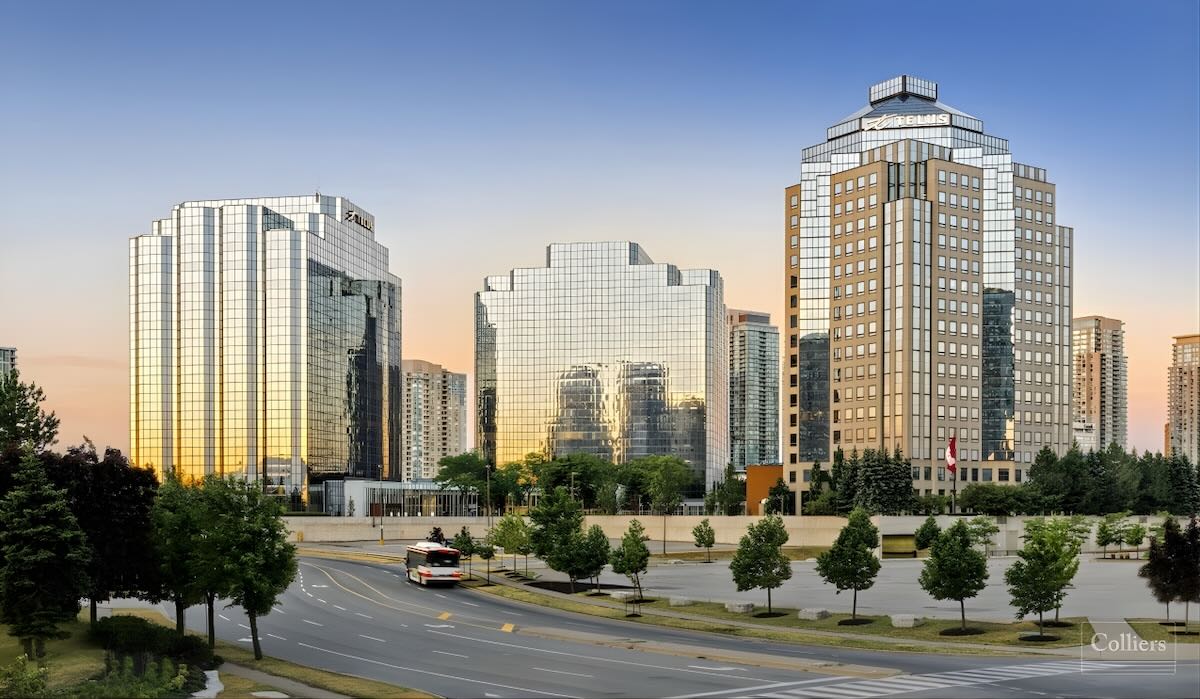 Photo of three-building complex of skyscrapers at dusk