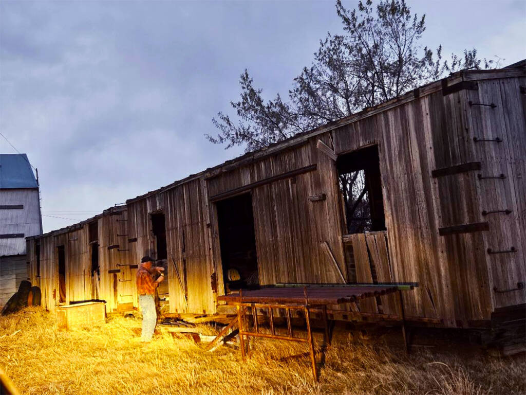 Two old wooden boxcars used as farm sheds. Restoring a World War II boxcar home.