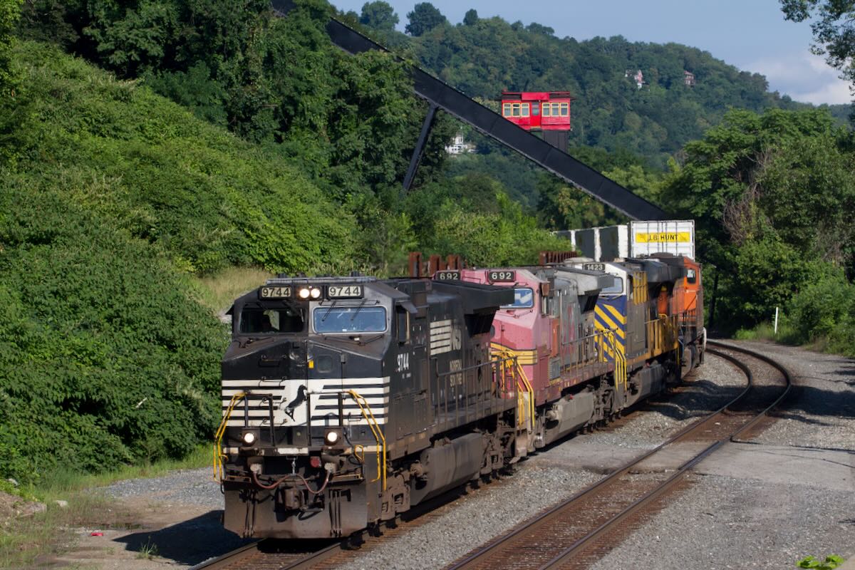 Funicular passing over freight train