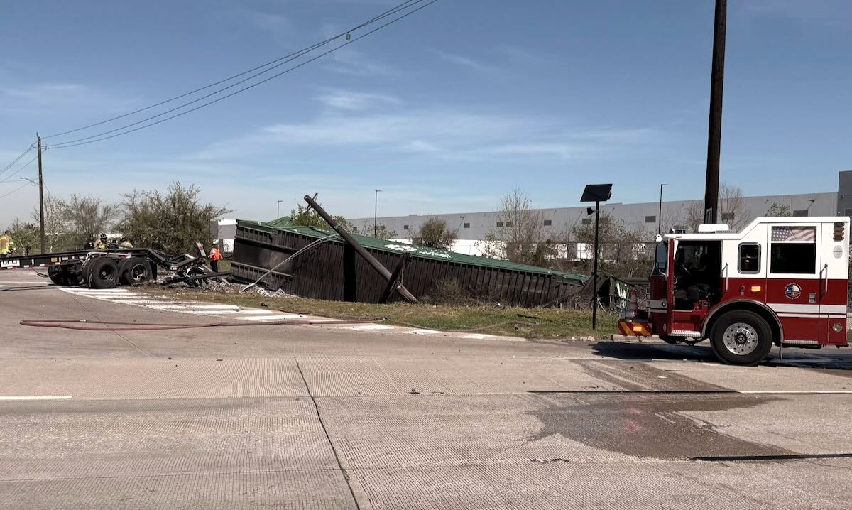 Smashed container next to fire truck